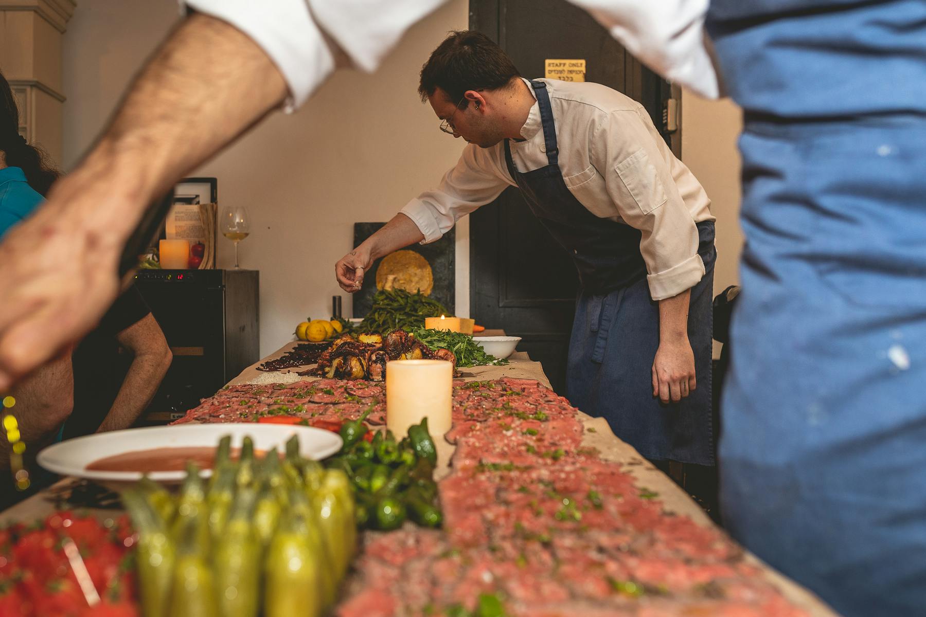 Chefs preparing and serving food for a private event