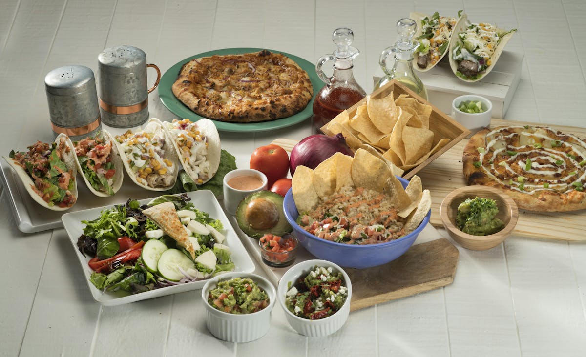 a bunch of different types of food on a table