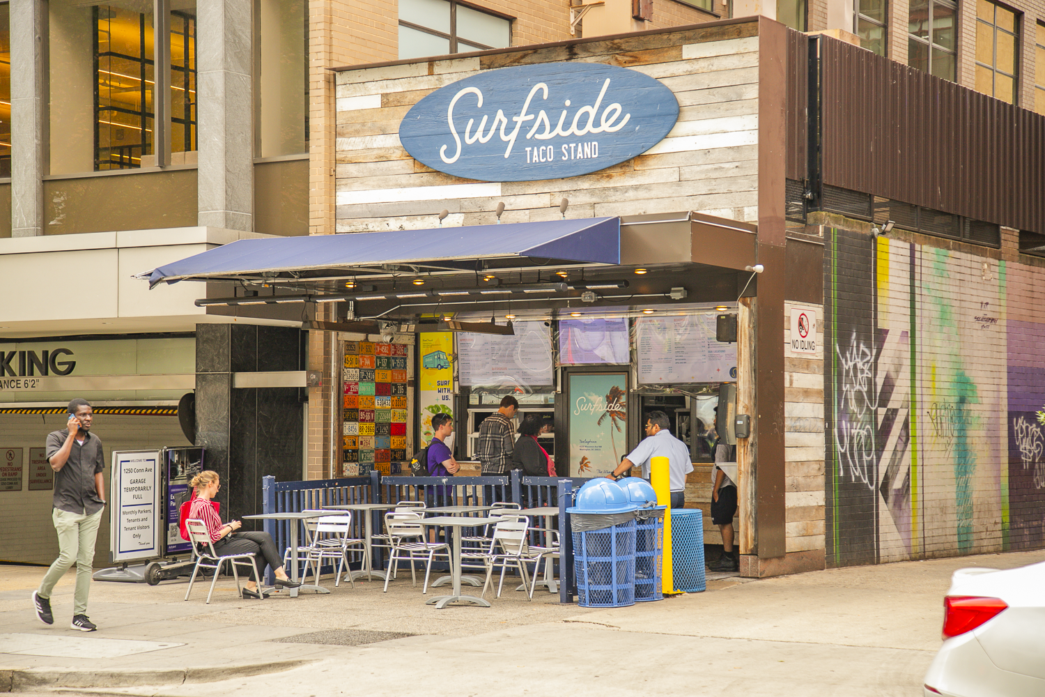 a restaurant with tables and chairs outside
