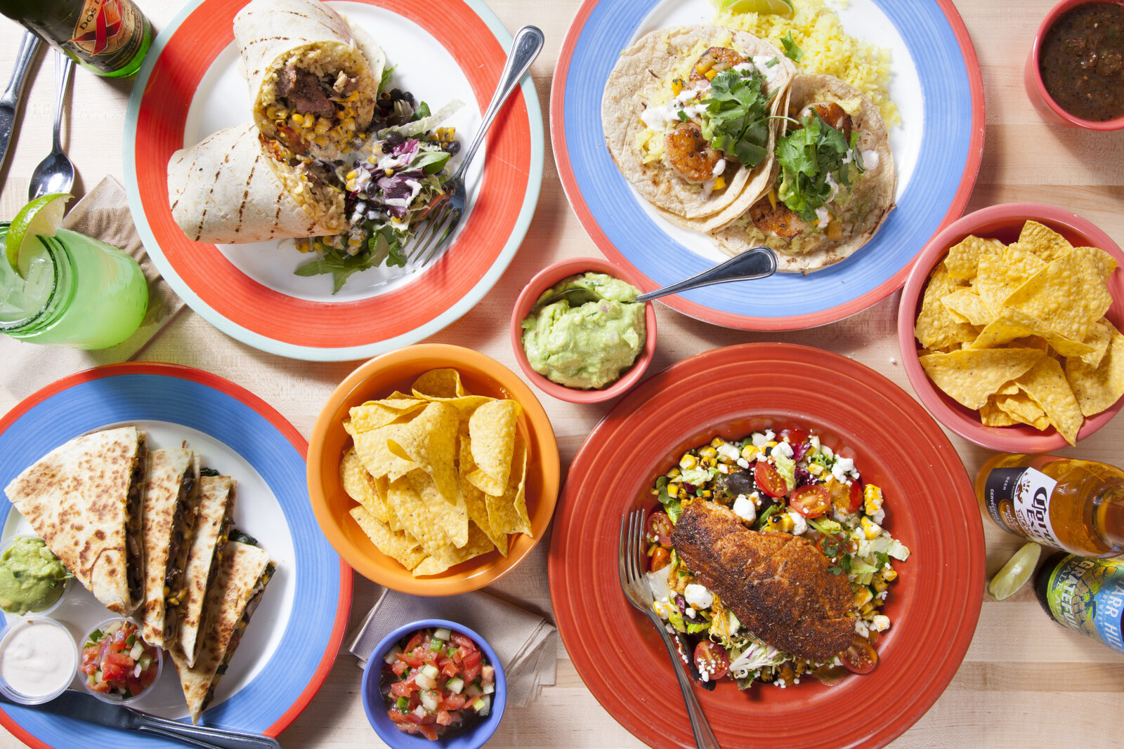 a bunch of food sitting on top of a wooden table