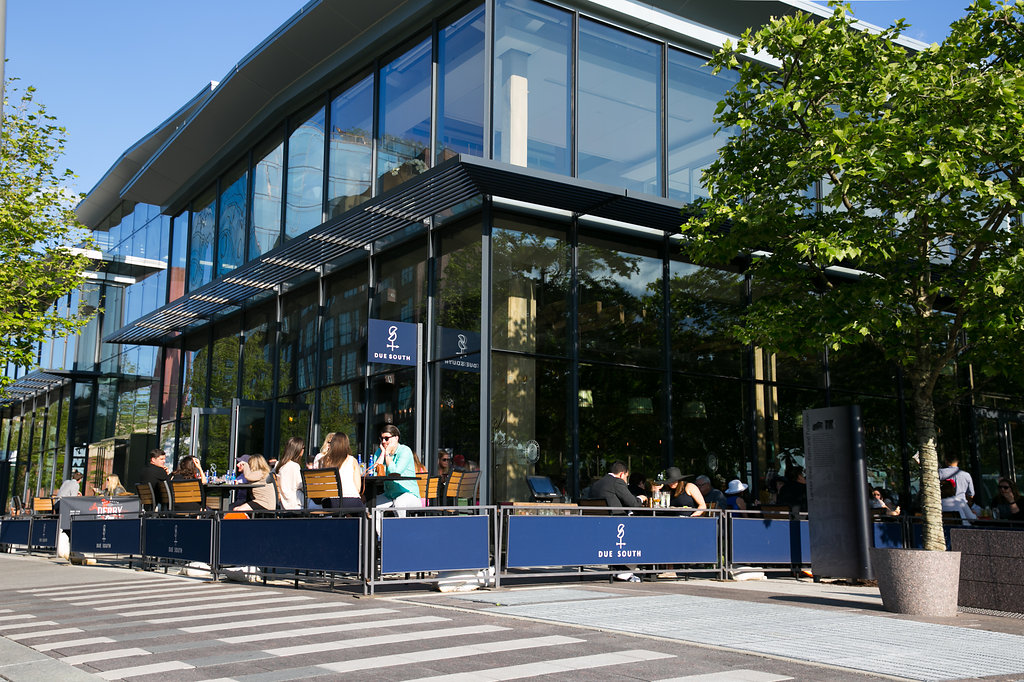 Outside exterior of Due South with people sitting on a patio