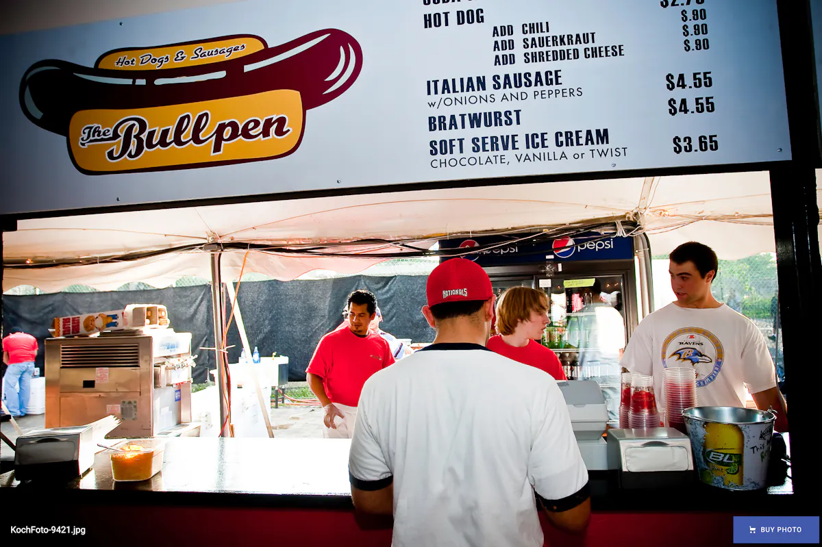 a group of people at a food stand