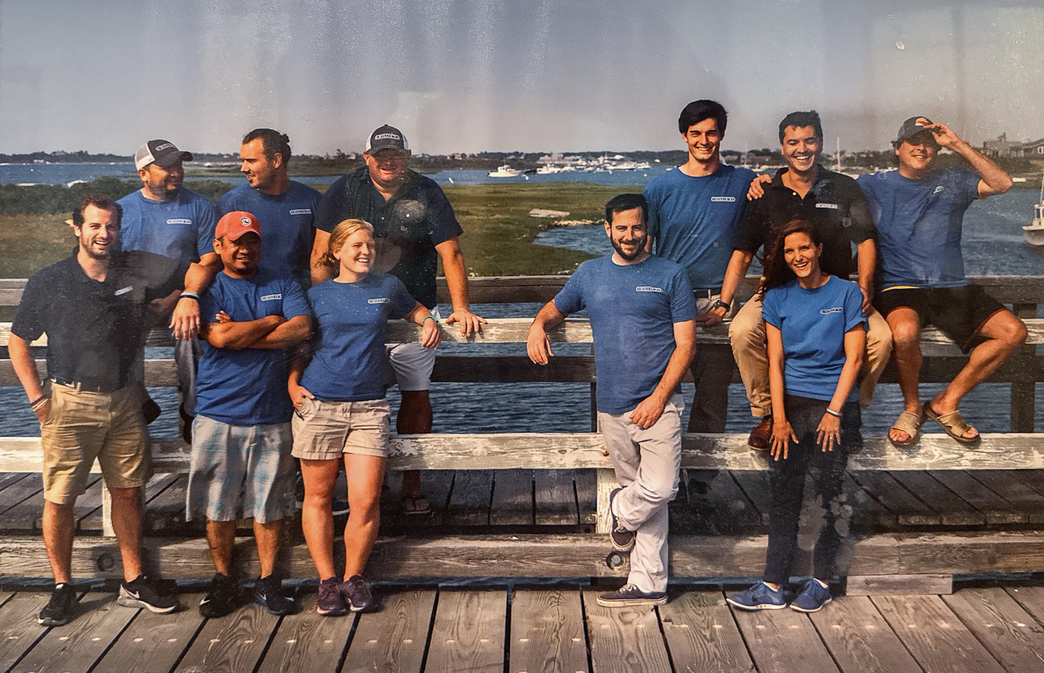 a group of people sitting at a table in a restaurant