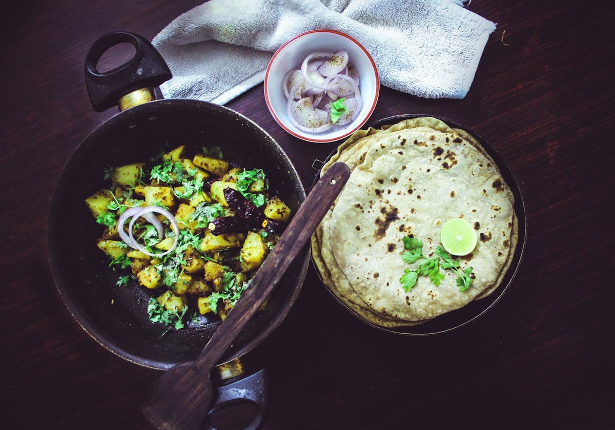 Naan bread and salad on a table