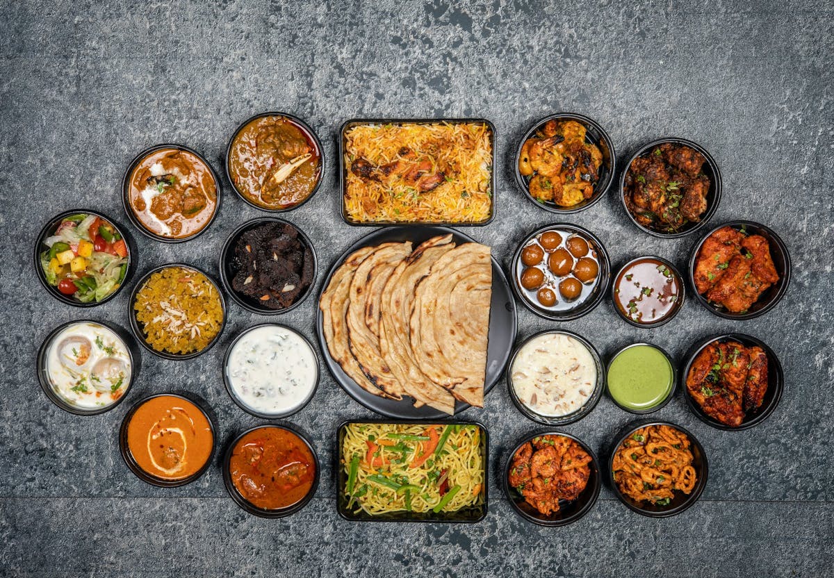 Indian bread, spreads, and spices on a table