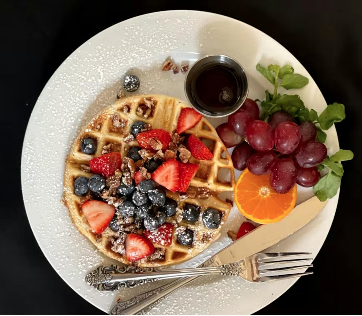 a bowl of fruit on a plate