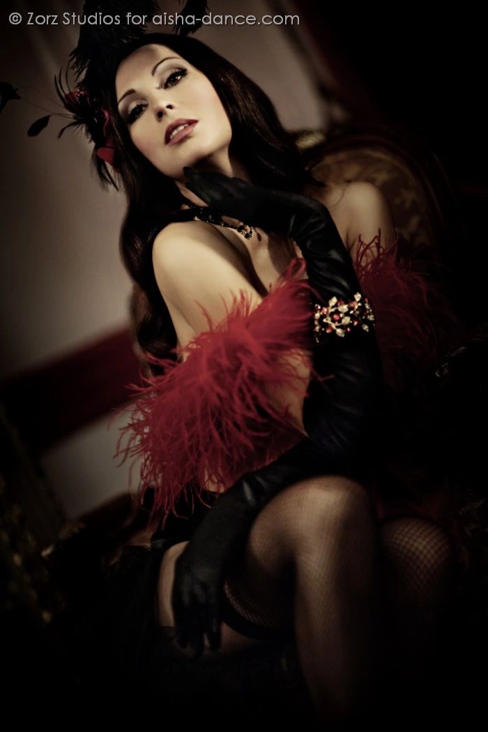 a woman sitting in a dark room