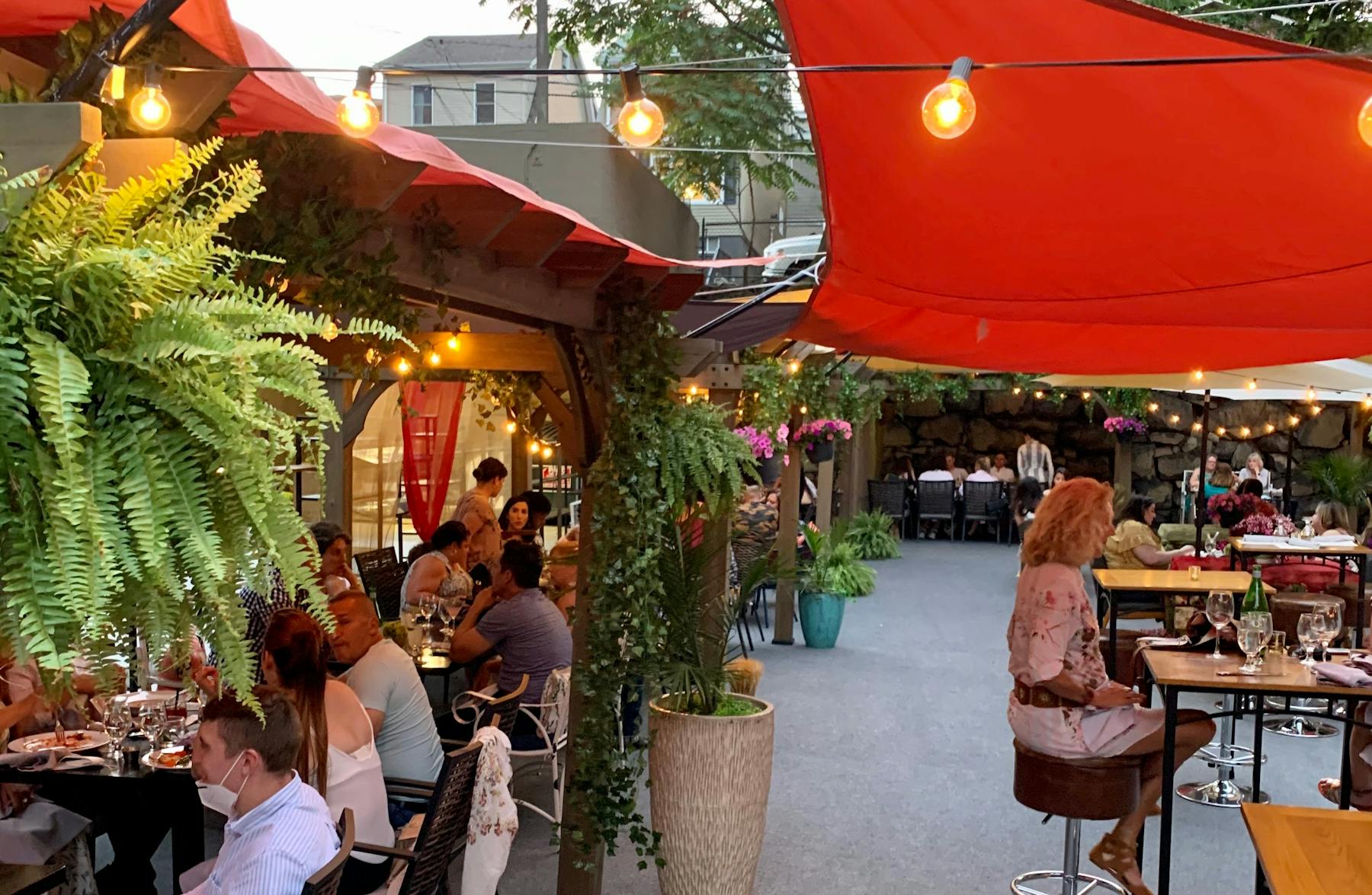 a group of people sitting at a table in a restaurant