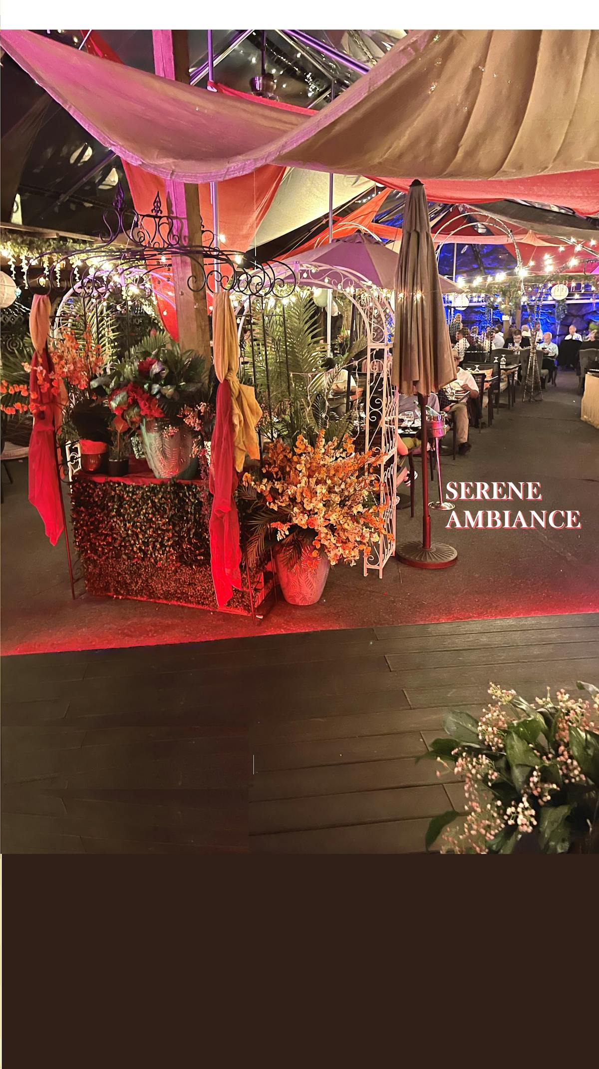 a room filled with furniture and vase of flowers on a table