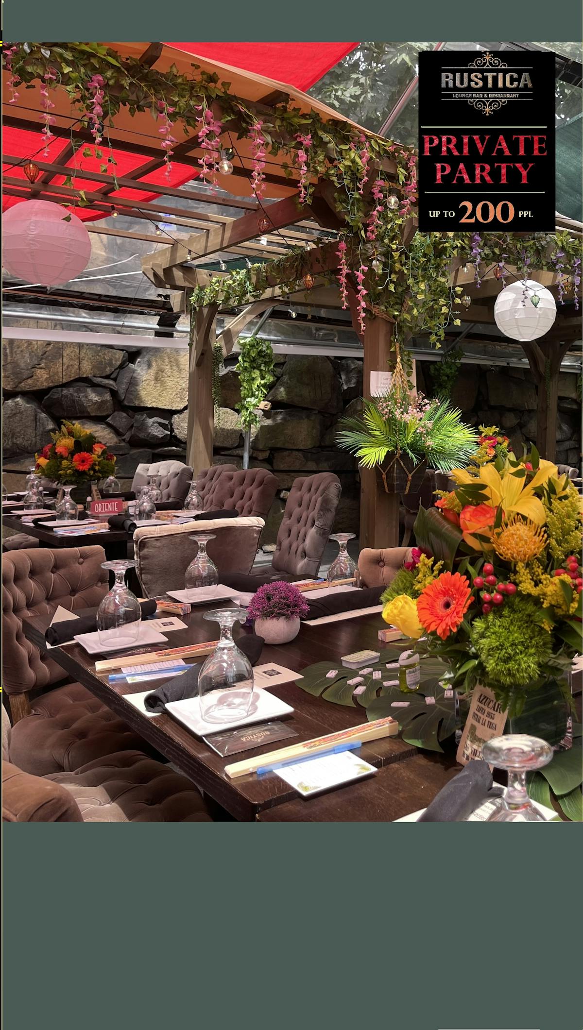 a living room filled with furniture and vase of flowers on a table