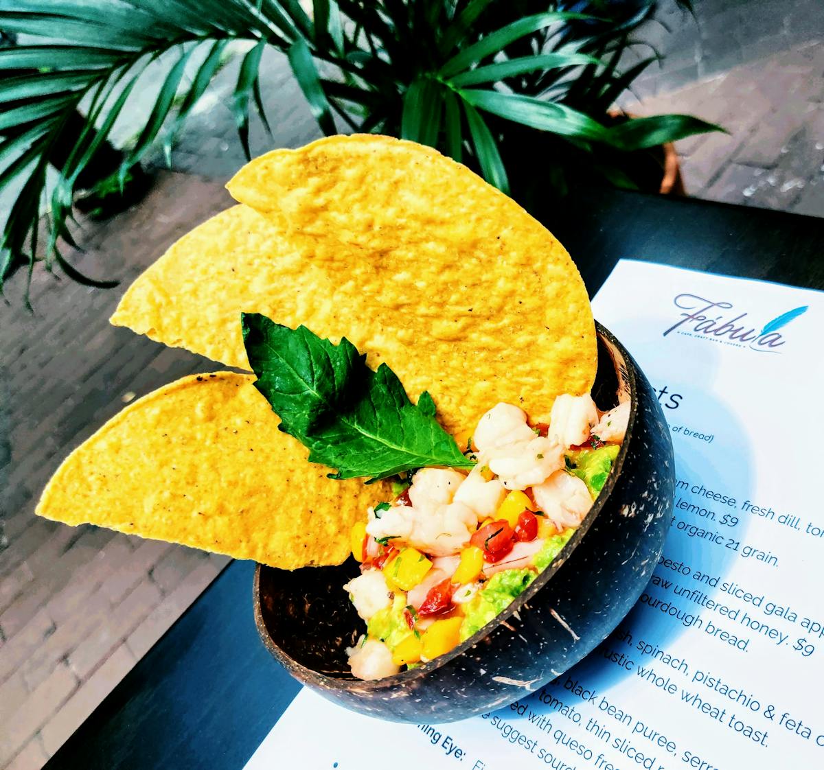 a plate of food with a green umbrella