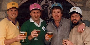 a group of people holding wine glasses