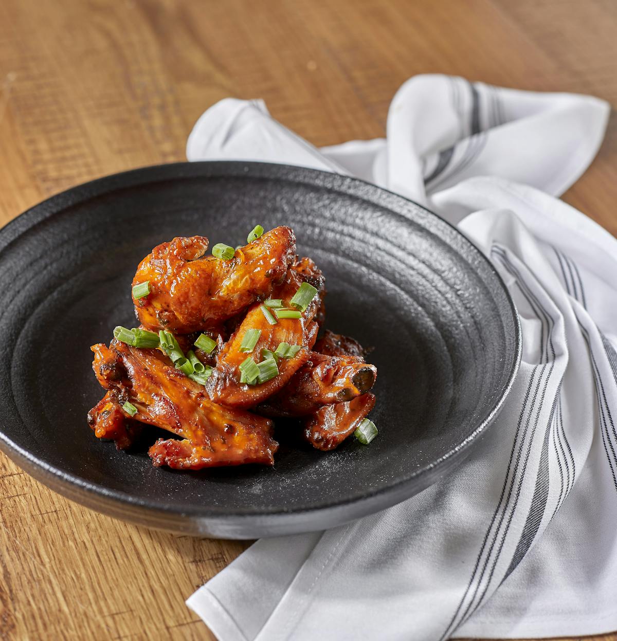 a plate of food sitting on top of a wooden table