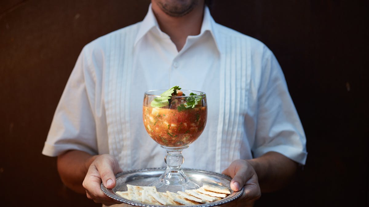 a man holding a glass of wine