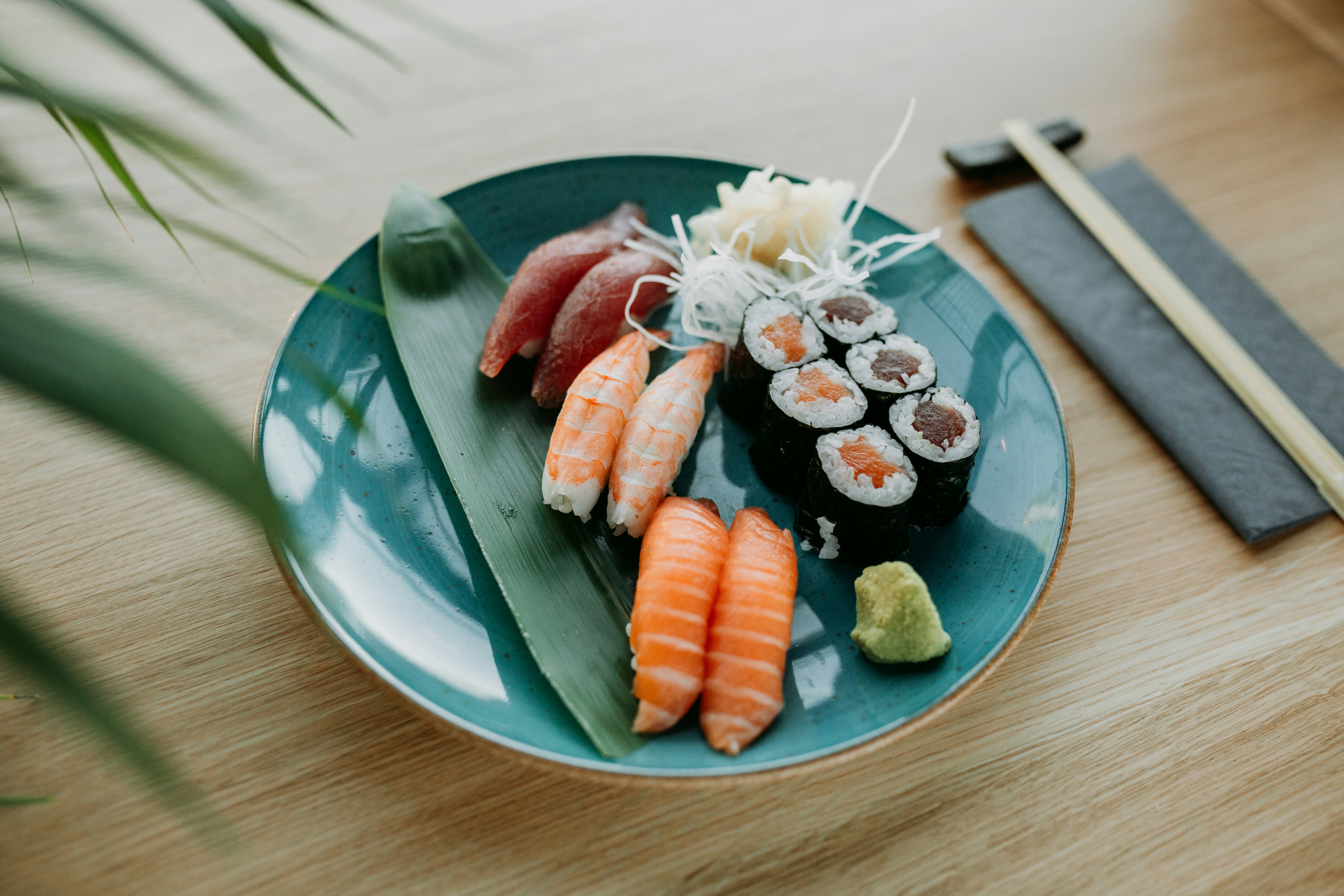 a plate of food sitting on top of a wooden table