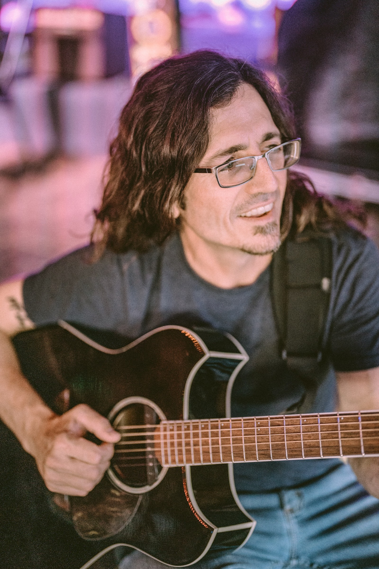 a man holding a guitar