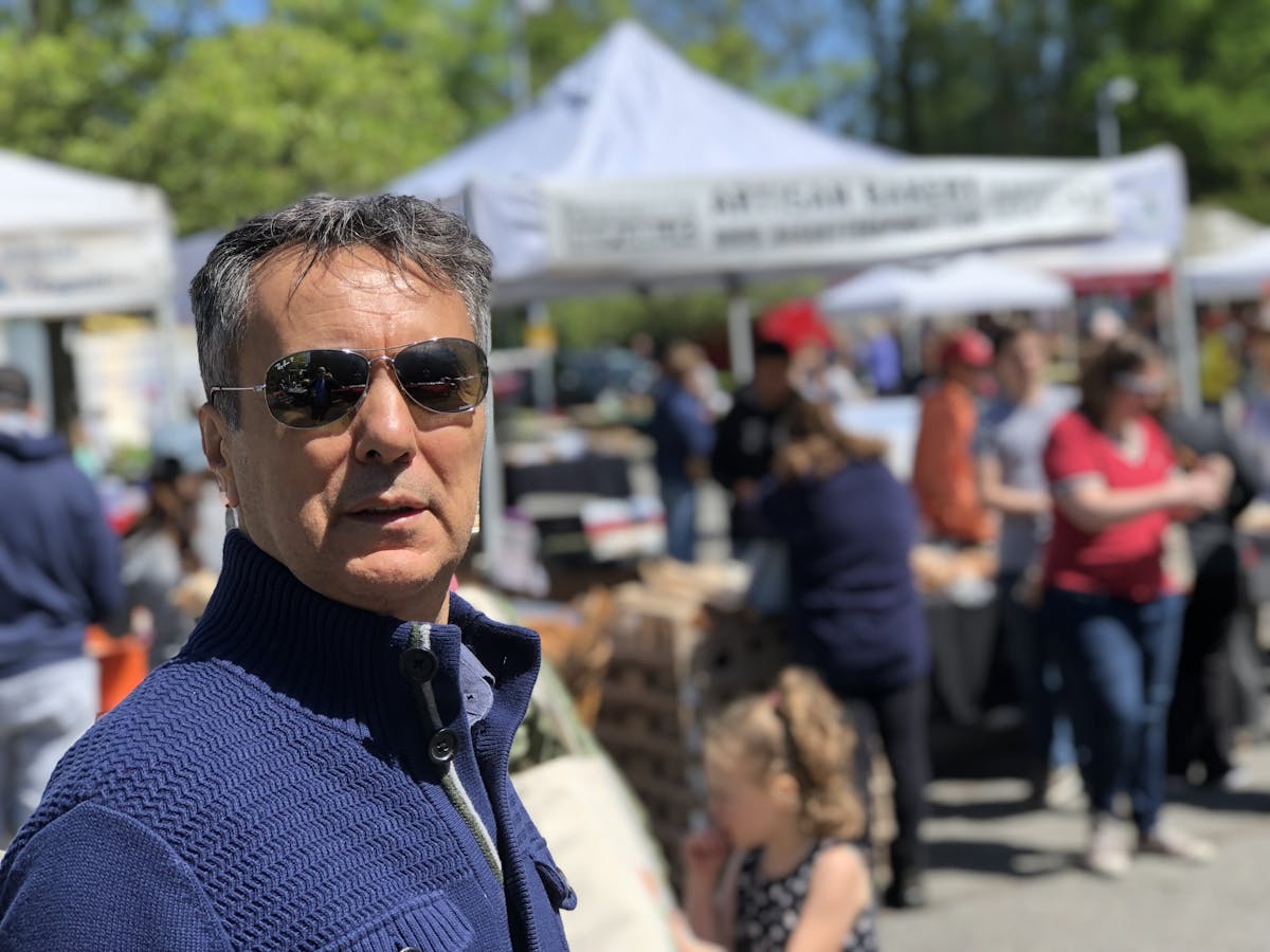 a man with sunglasses looking at the camera