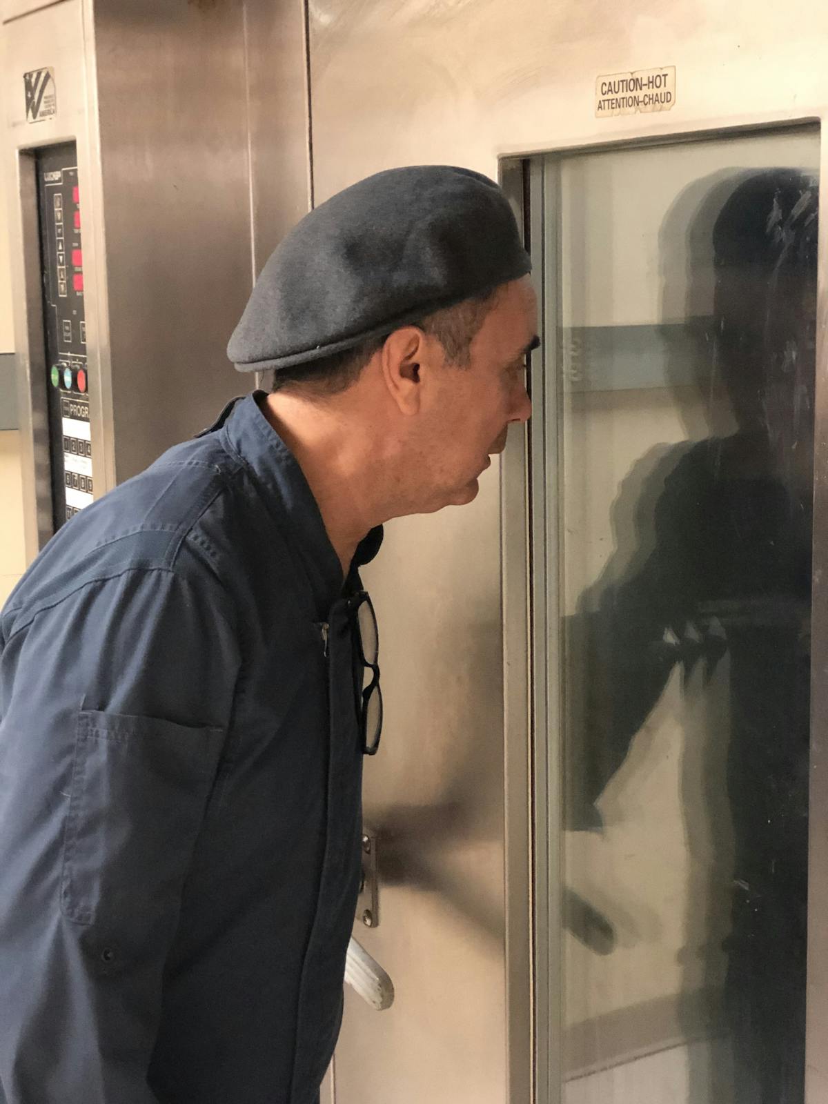 a man looking at a fridge door