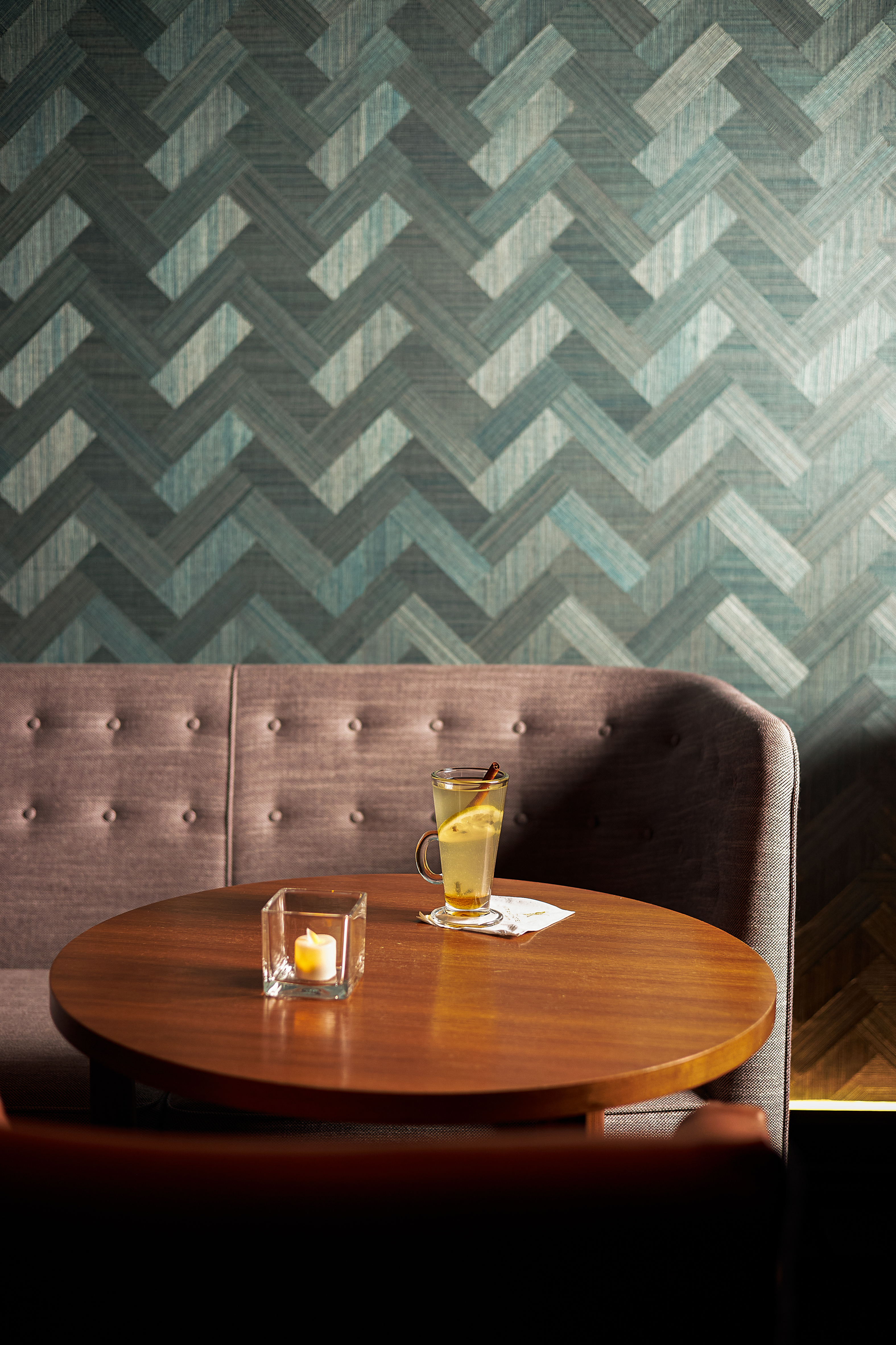 a vase sitting on top of a wooden table