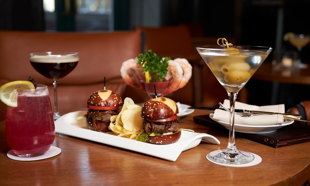 a plate of food and a glass of wine