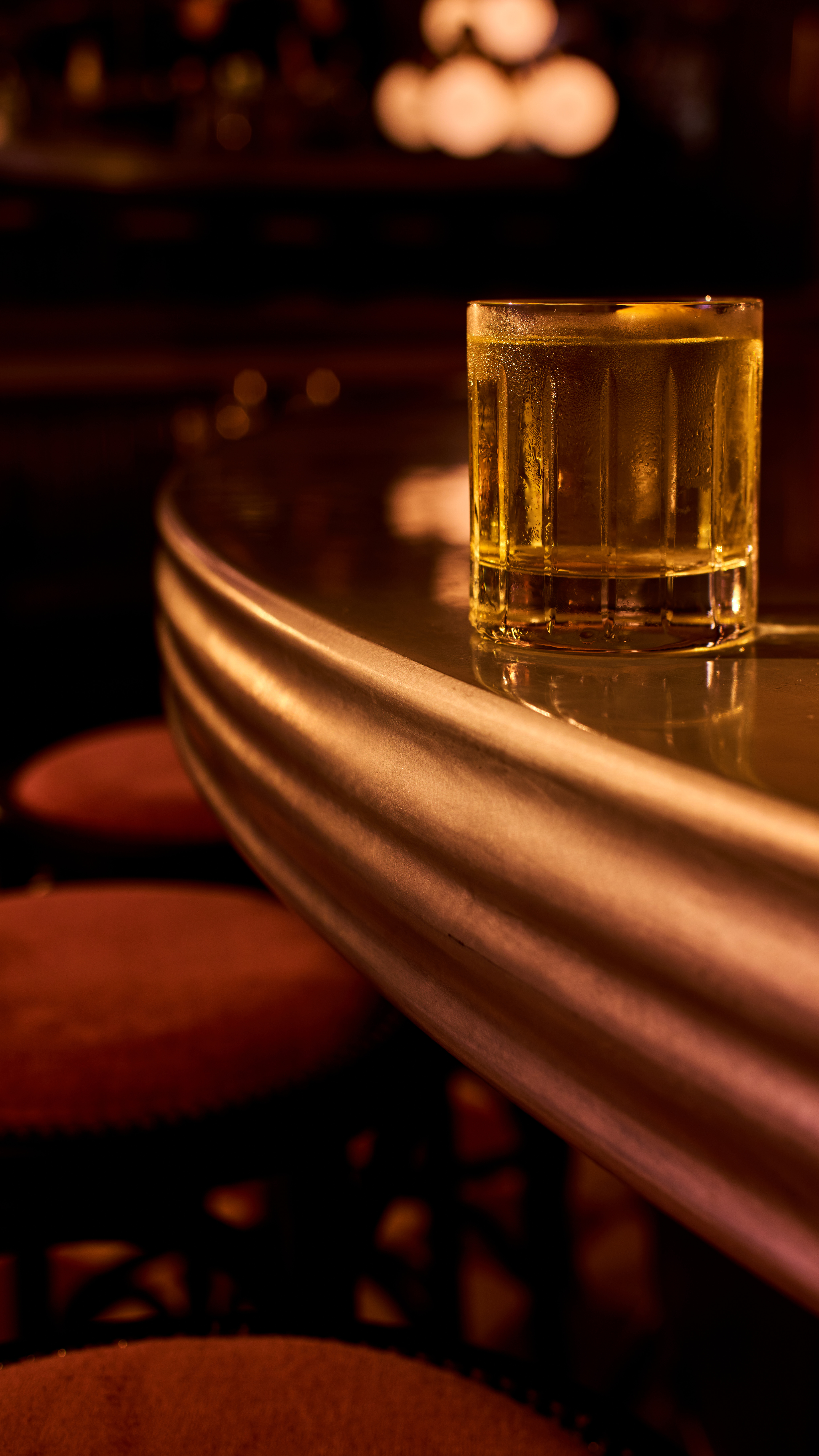 a glass of beer on a table