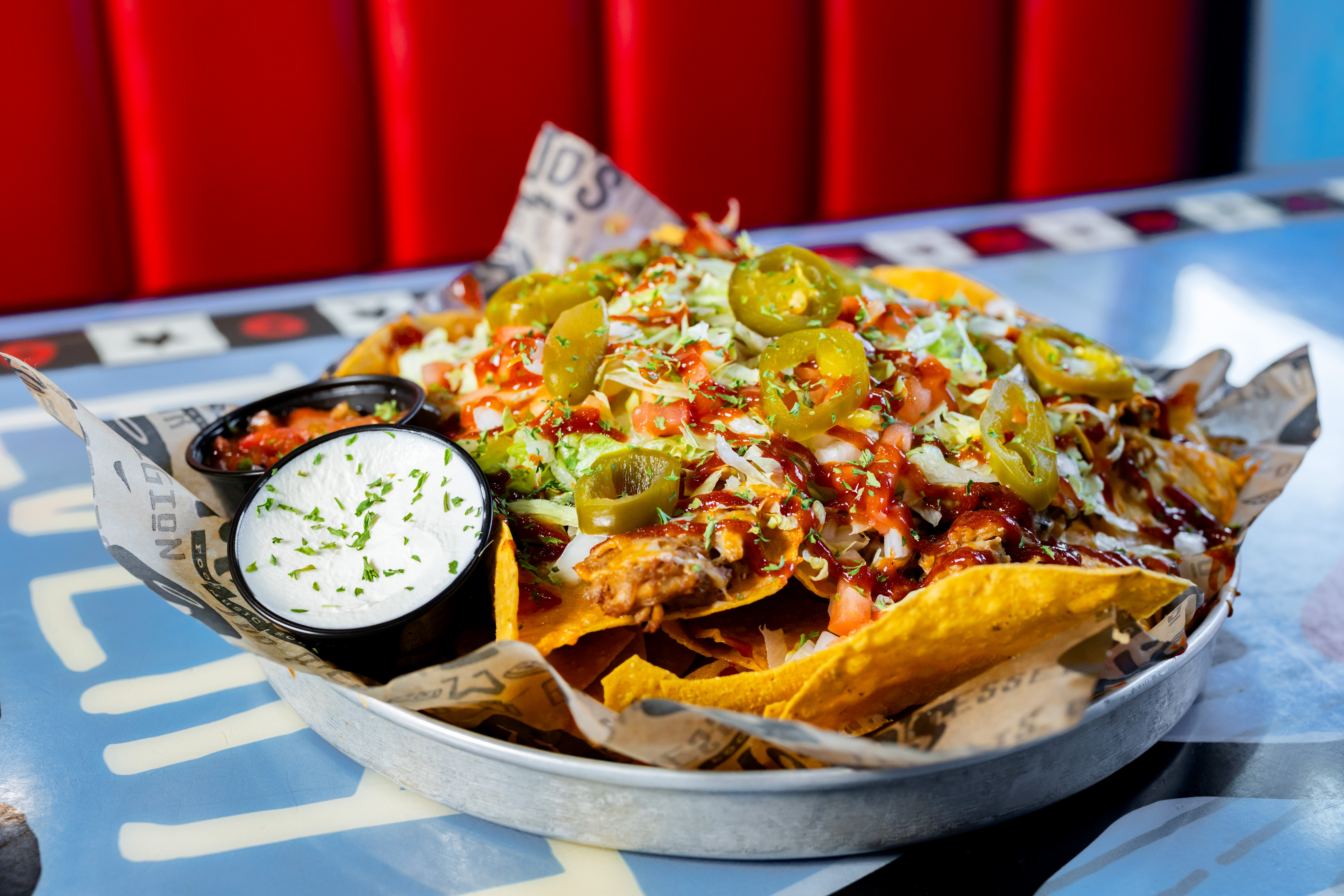 a slice of pizza sitting on top of a paper plate