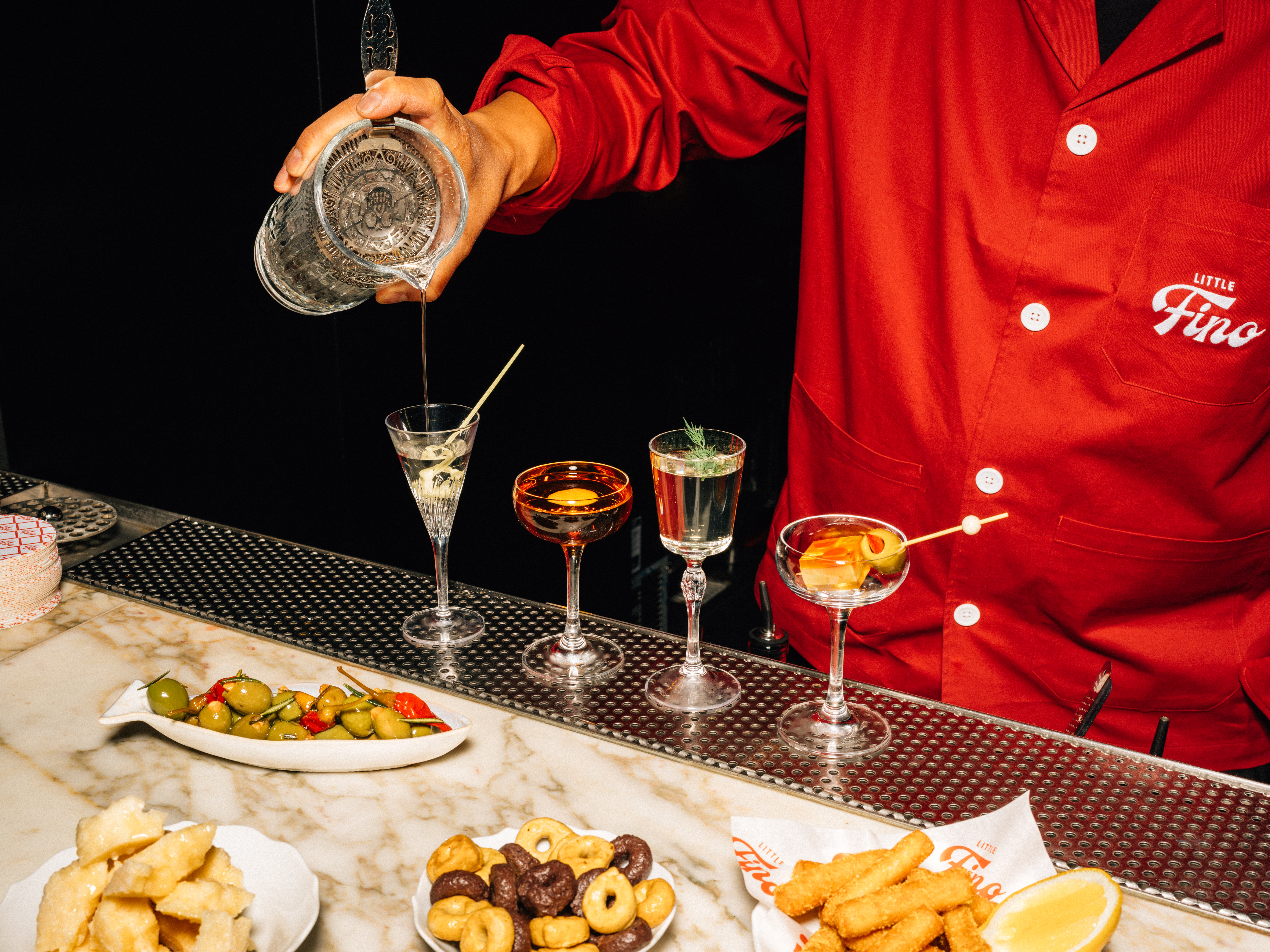 a person sitting at a table with a plate of food