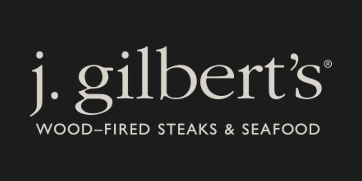 J Gilbert's Wood-Fired Steaks & Seafood restaurant logo - View nutrition facts, calories, and macros for menu items at 1010 Capitol Ave Omaha, NE 68102