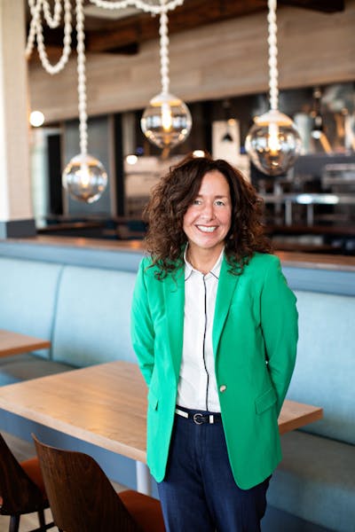 a woman standing in front of a table