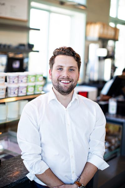 a man standing in front of a store