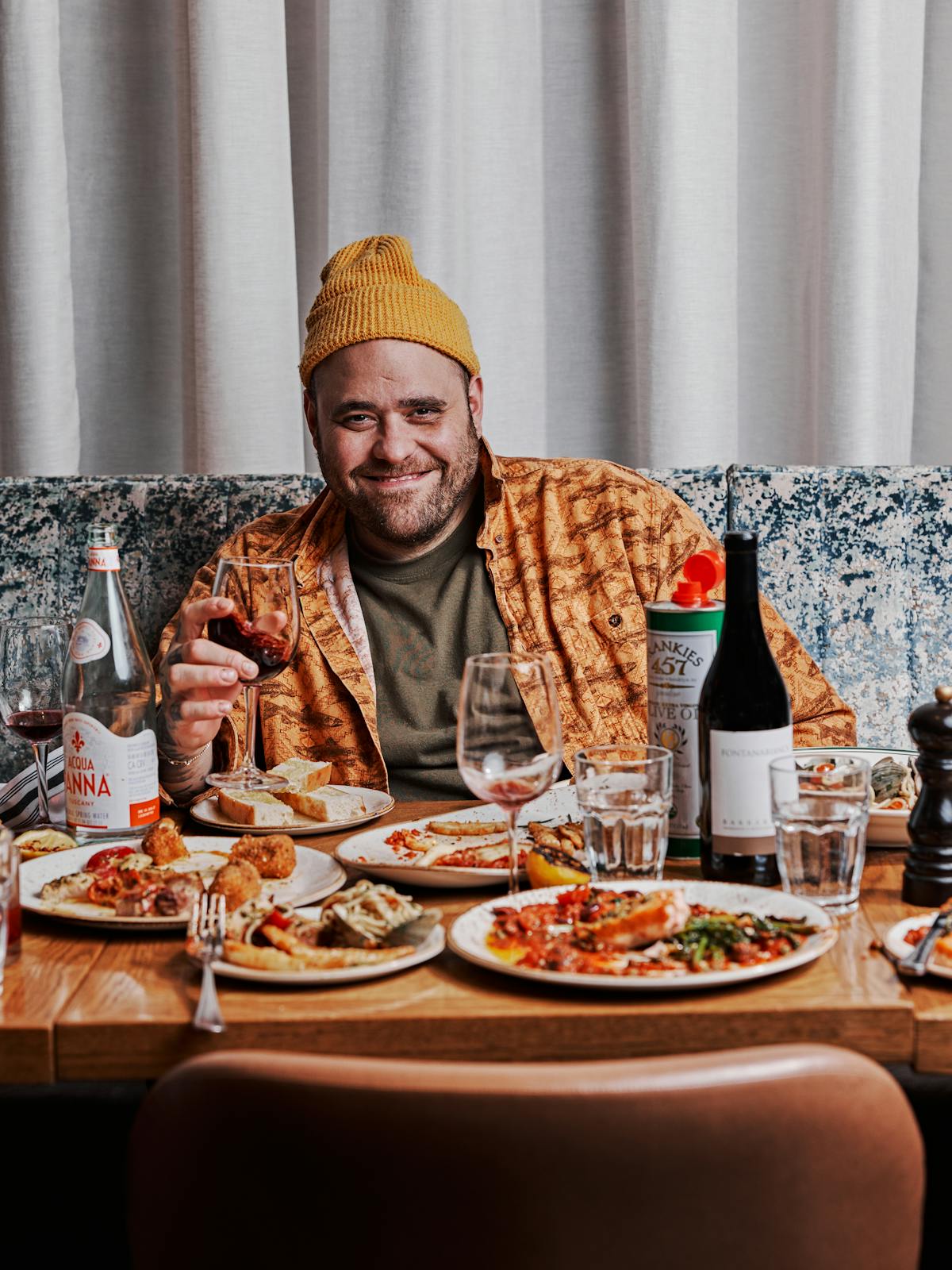 a man sitting at a table eating food