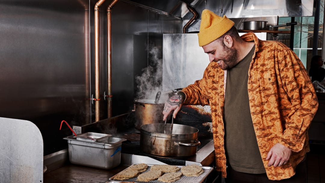 a man cooking in a kitchen
