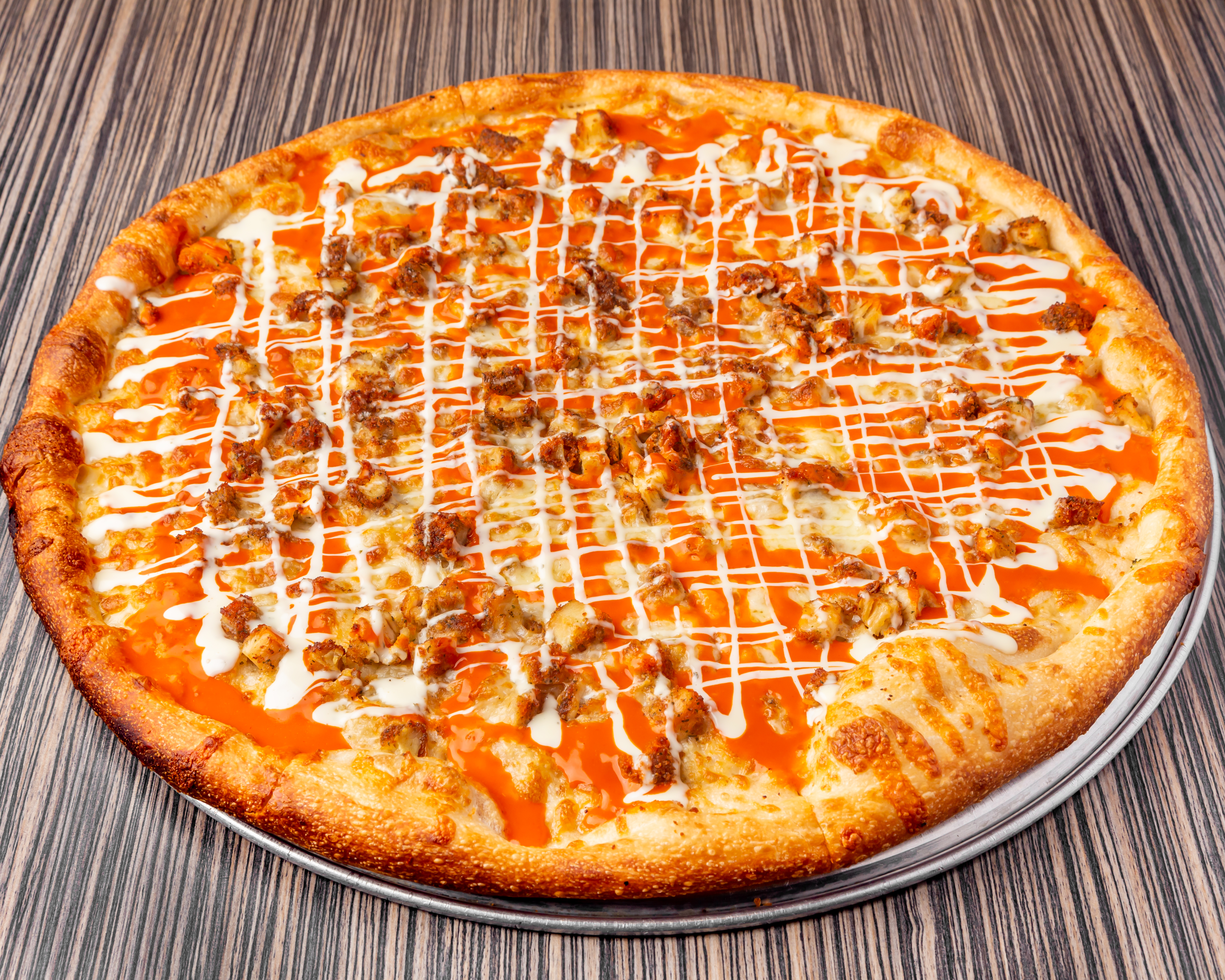 a pizza sitting on top of a wooden table