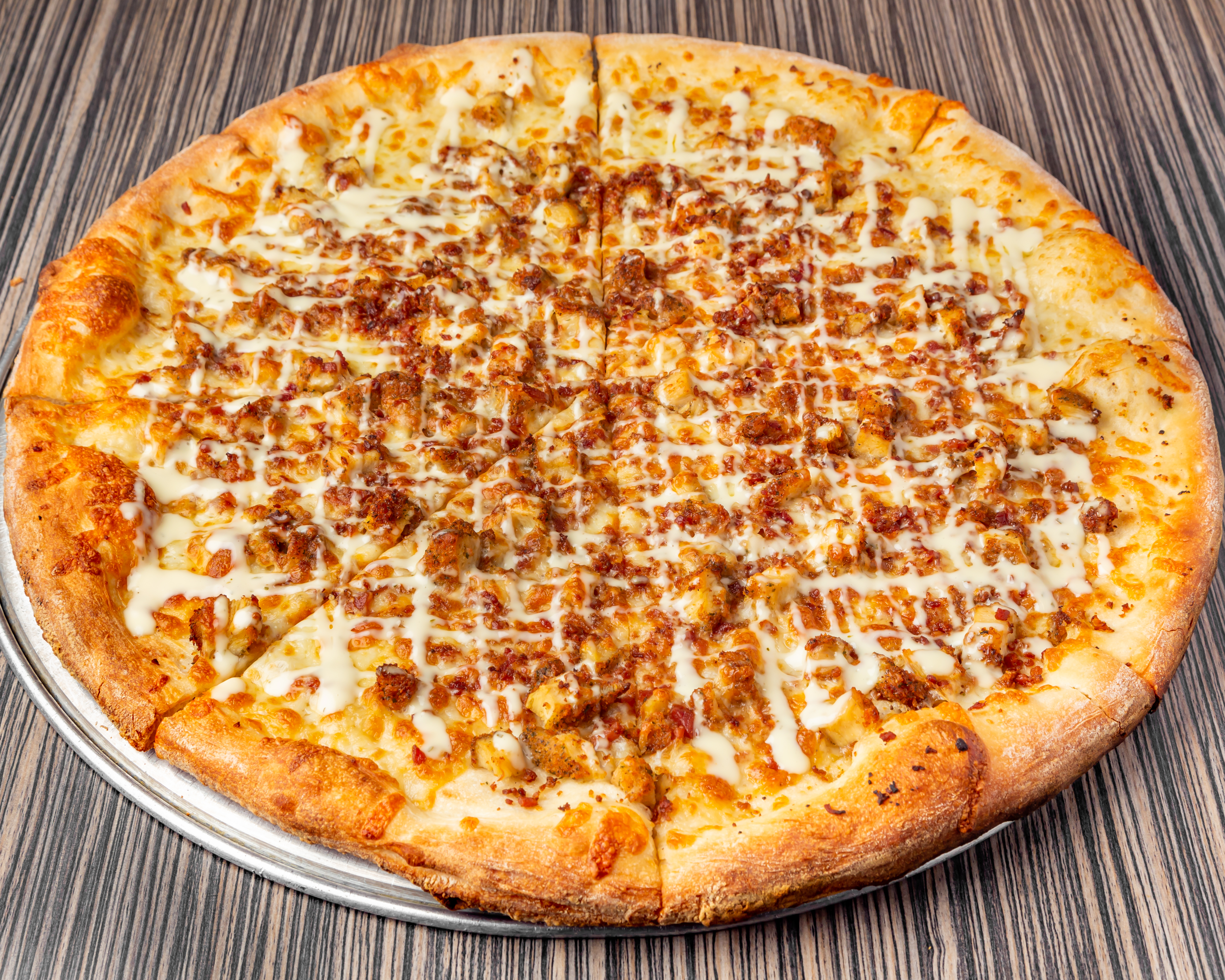 a pizza sitting on top of a wooden table