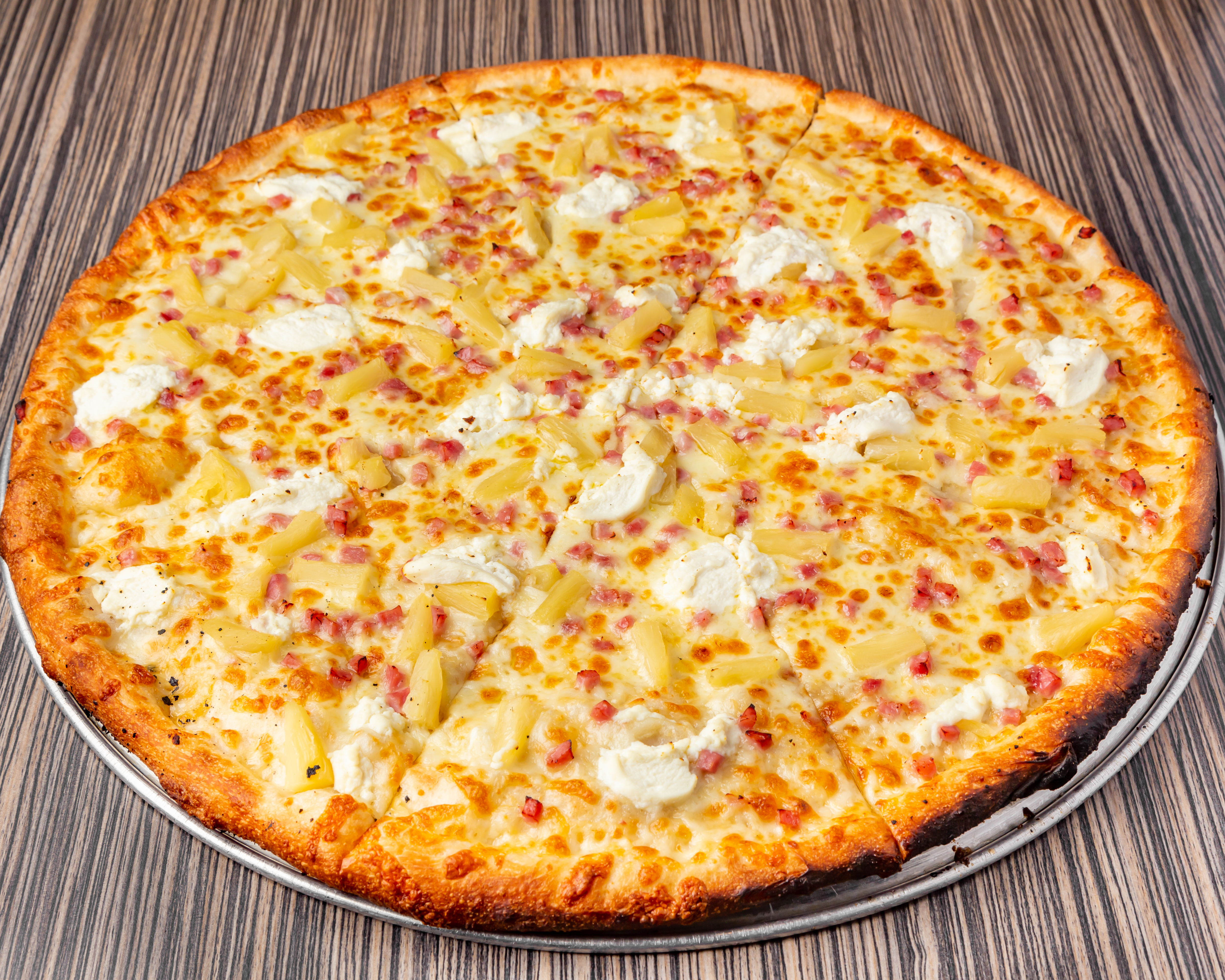 a pizza sitting on top of a metal pan
