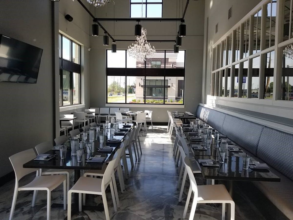 a large room with several dining tables