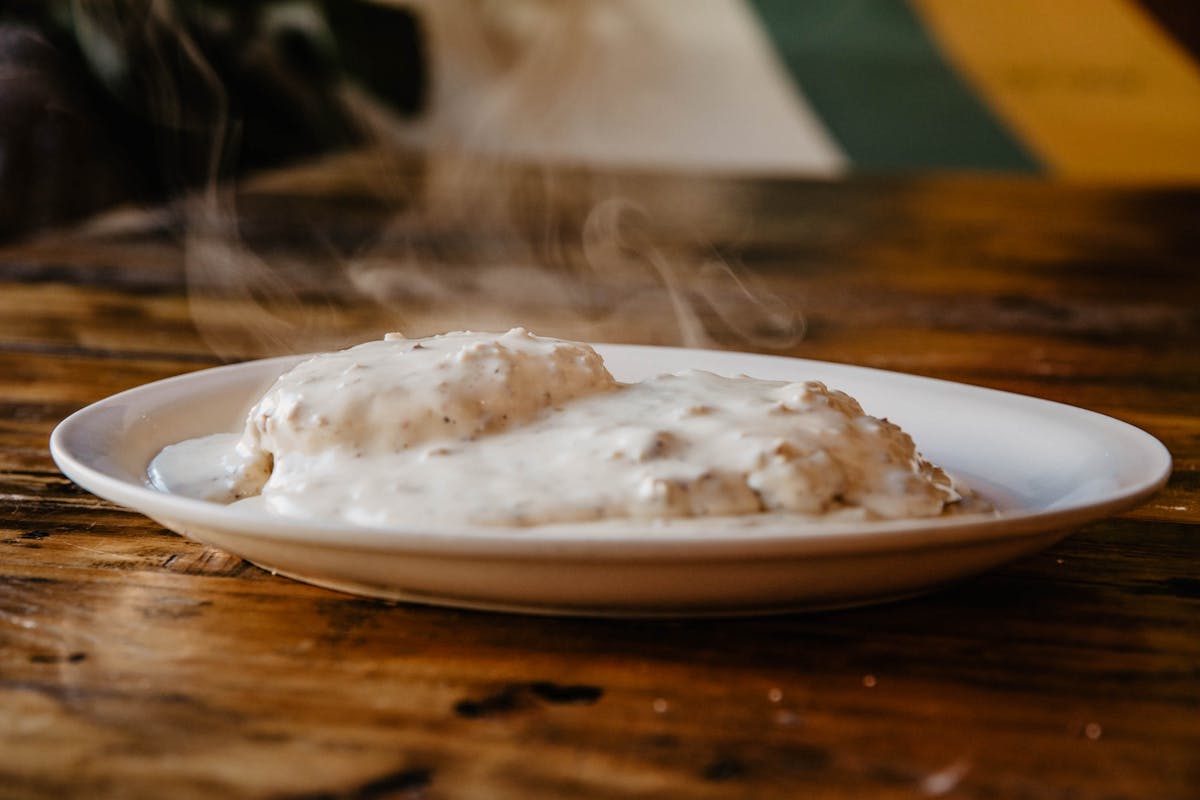 a bowl of food on a plate on a table