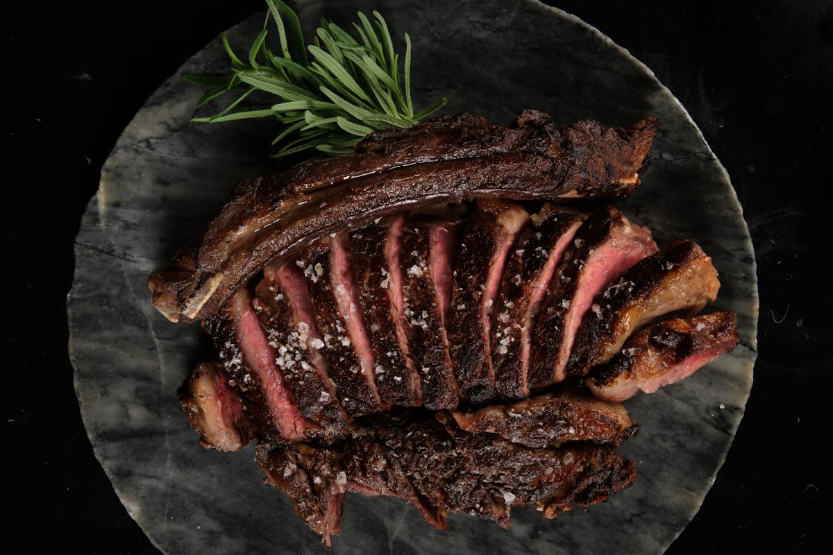 a plate of wagyu black angus sprinkled with salt flakes