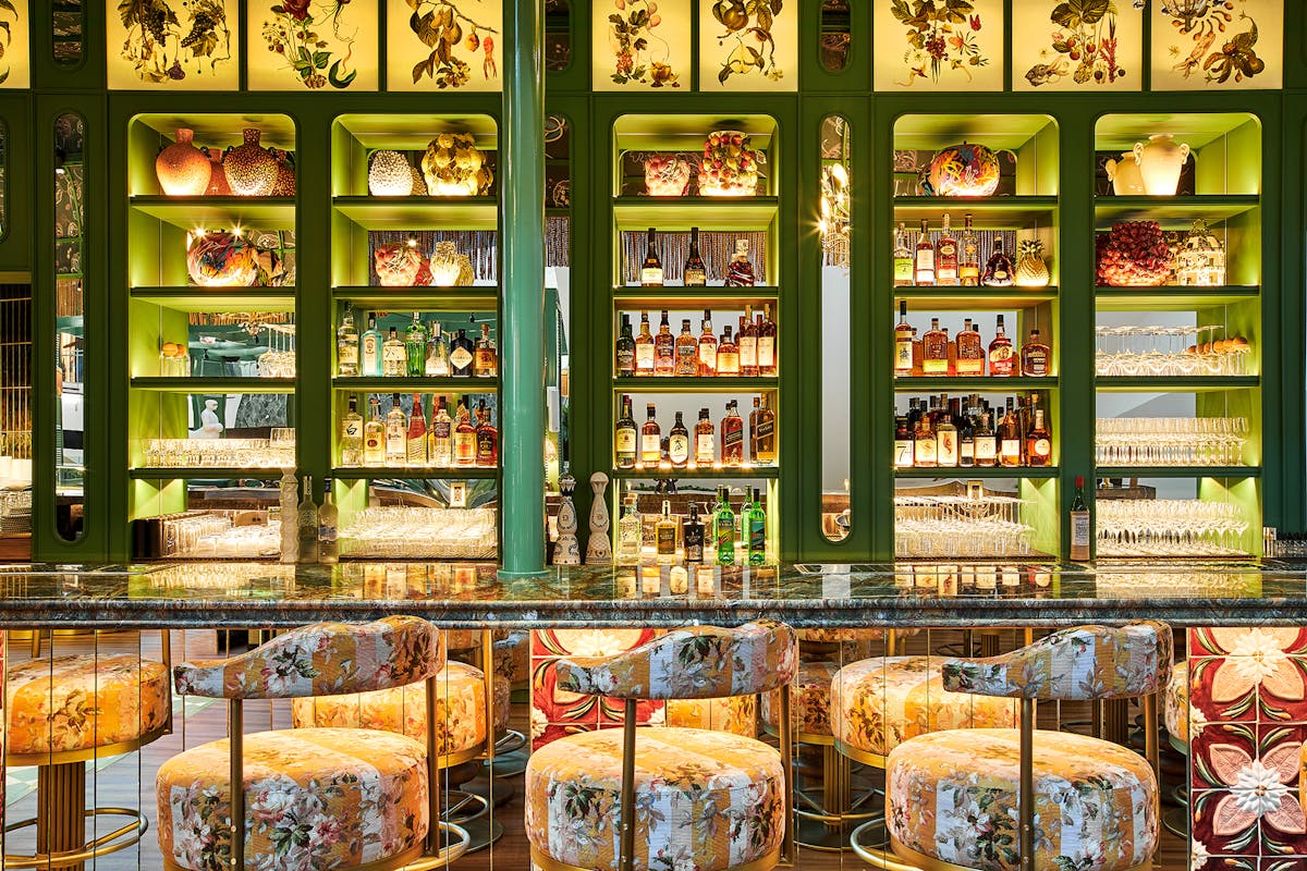 a close up shot of a bar with several bottles of spirits