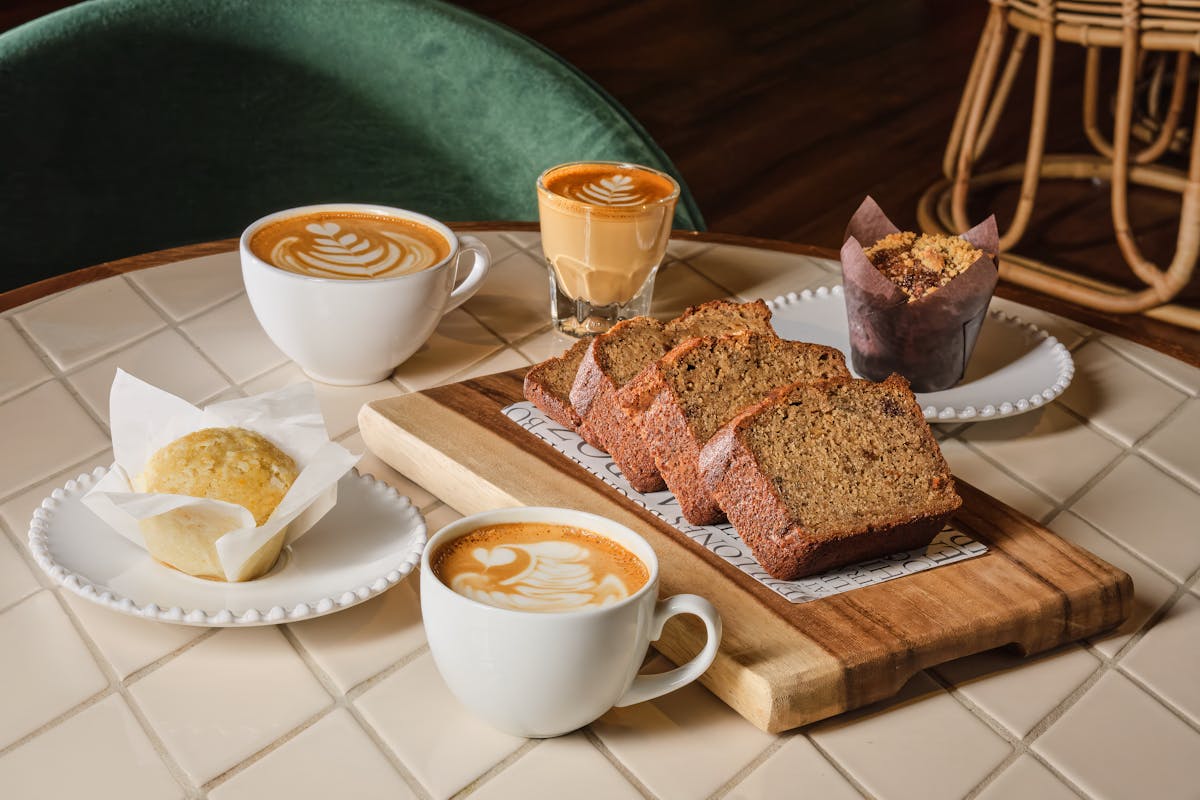 a plate of food and a cup of coffee on a table