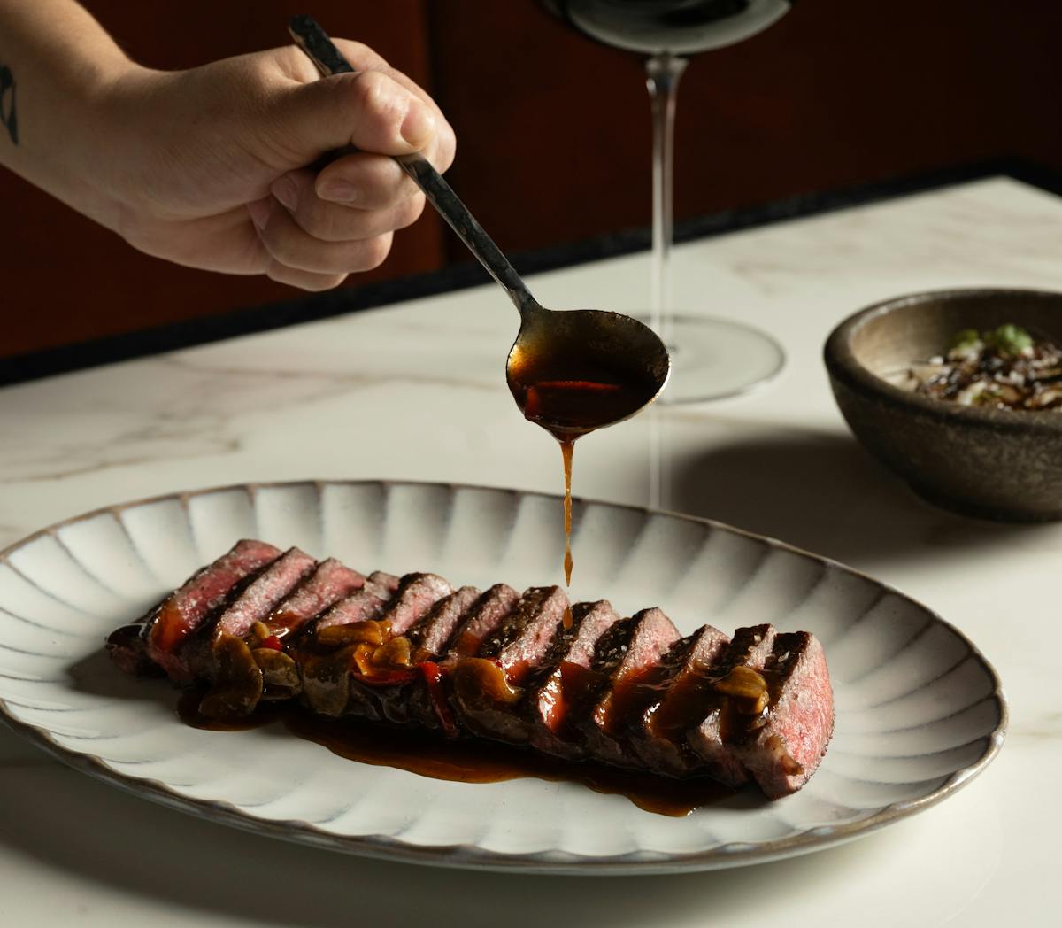 a plate of food and a glass of wine