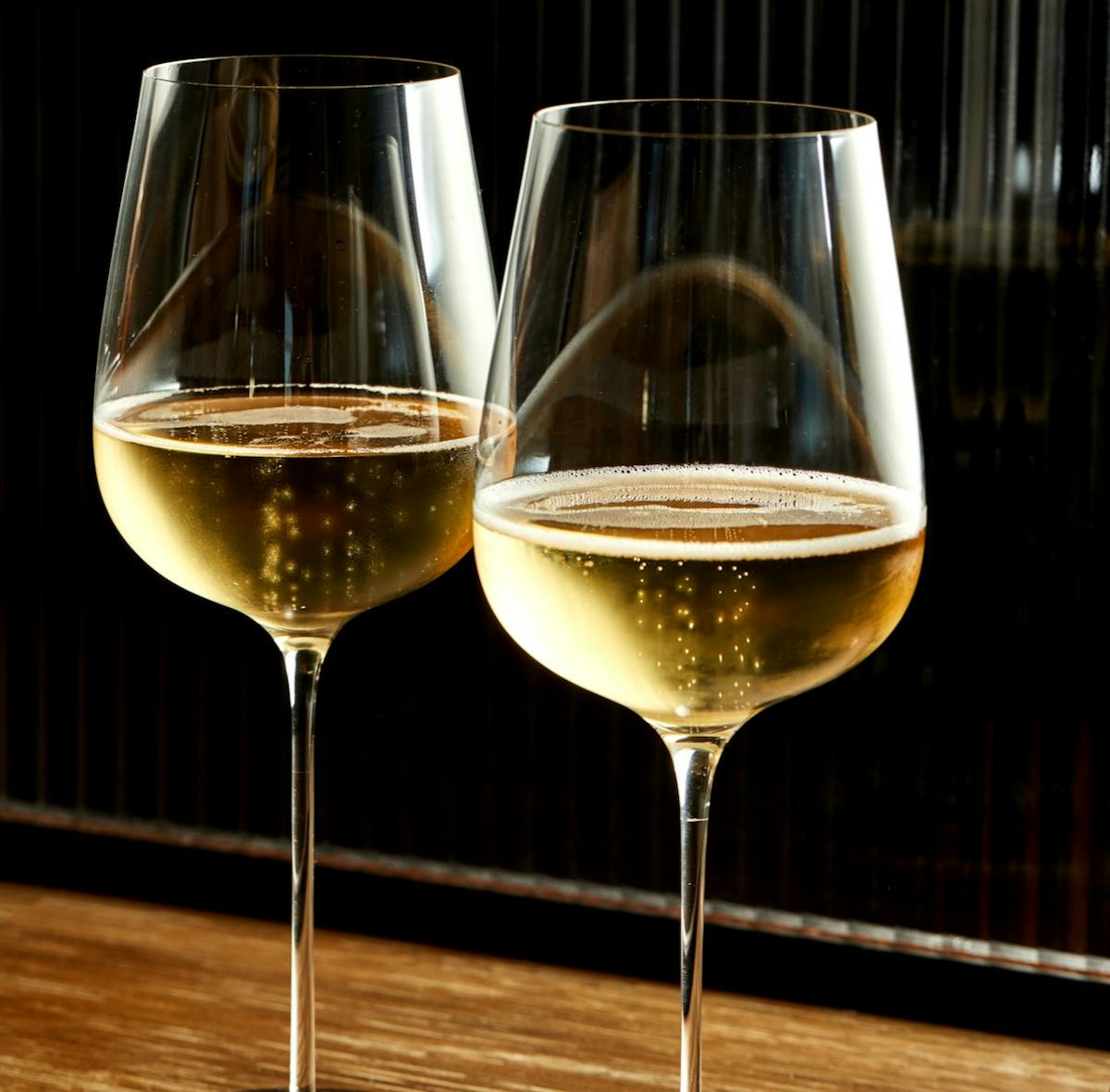 a close up of two glasses of wine