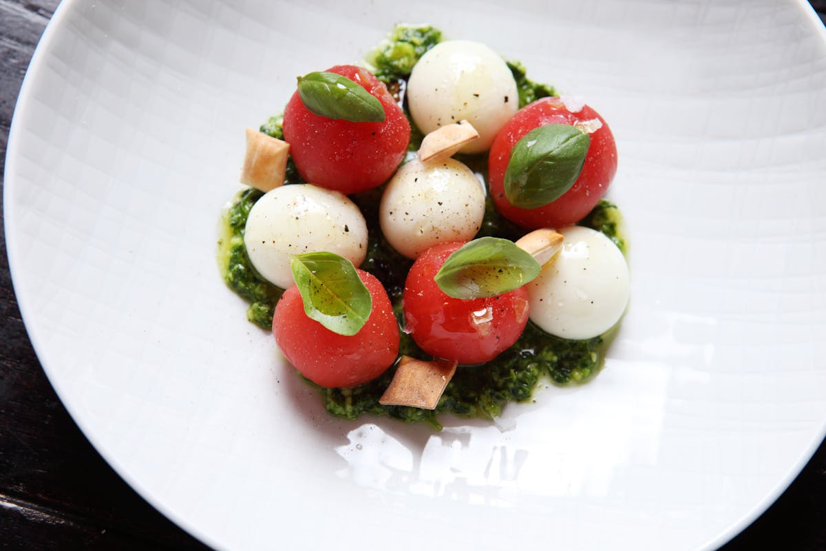 a plate of Not Your Average Caprese on a table