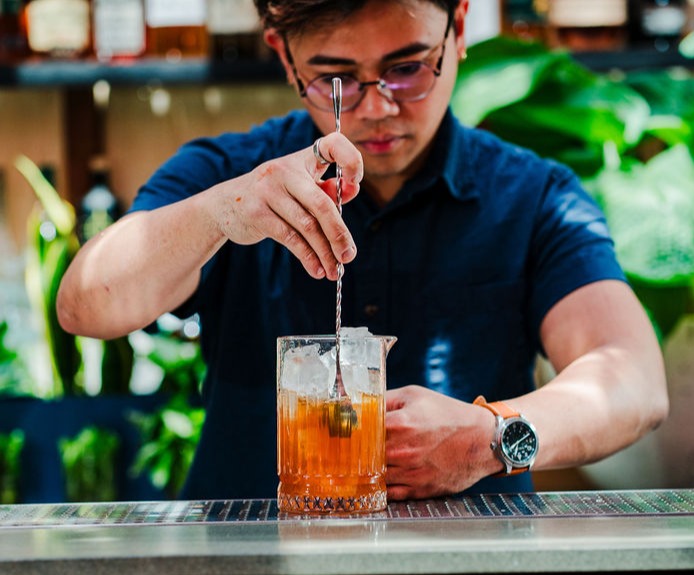 a person drinking from a glass