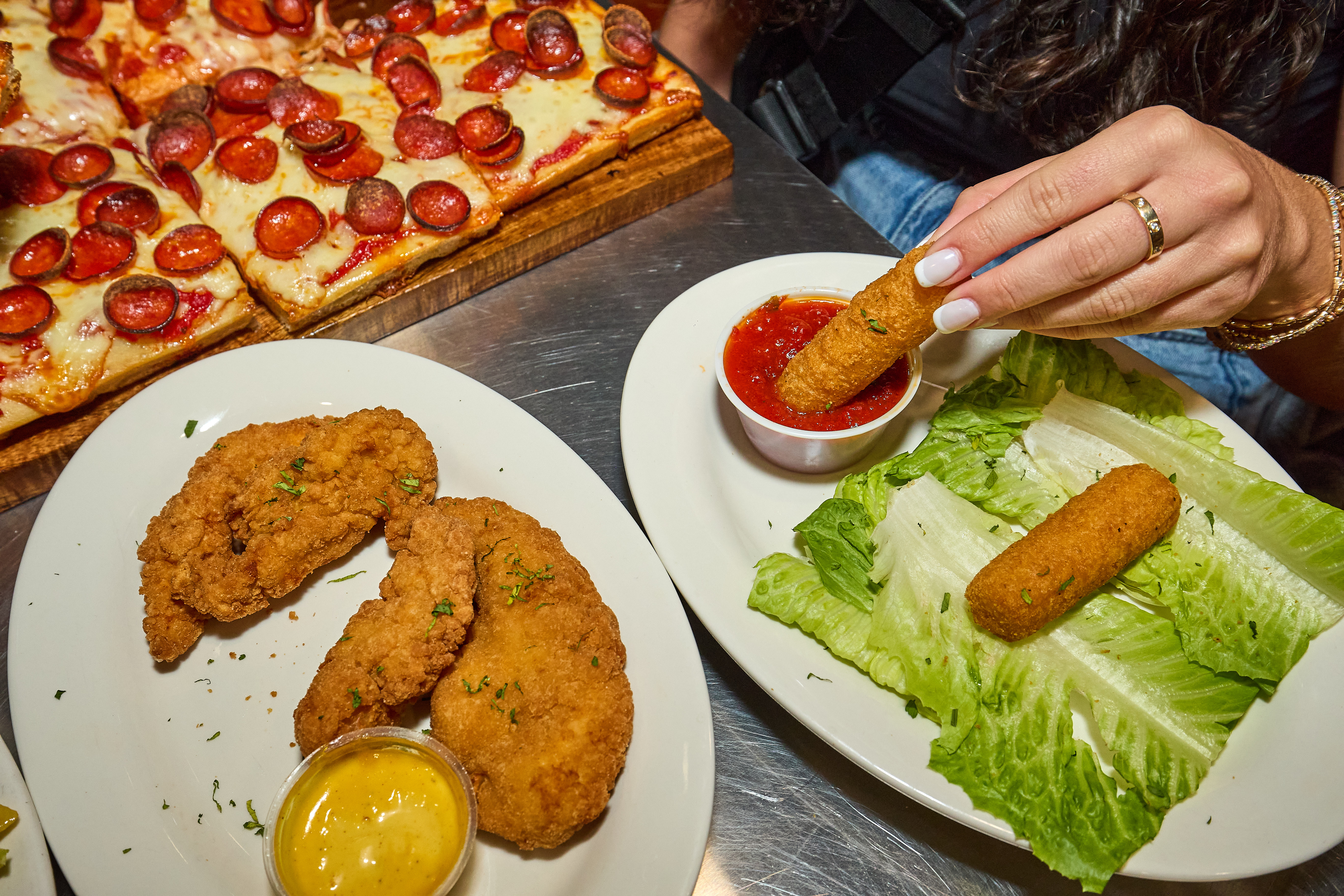 a pizza sitting on top of a plate of food