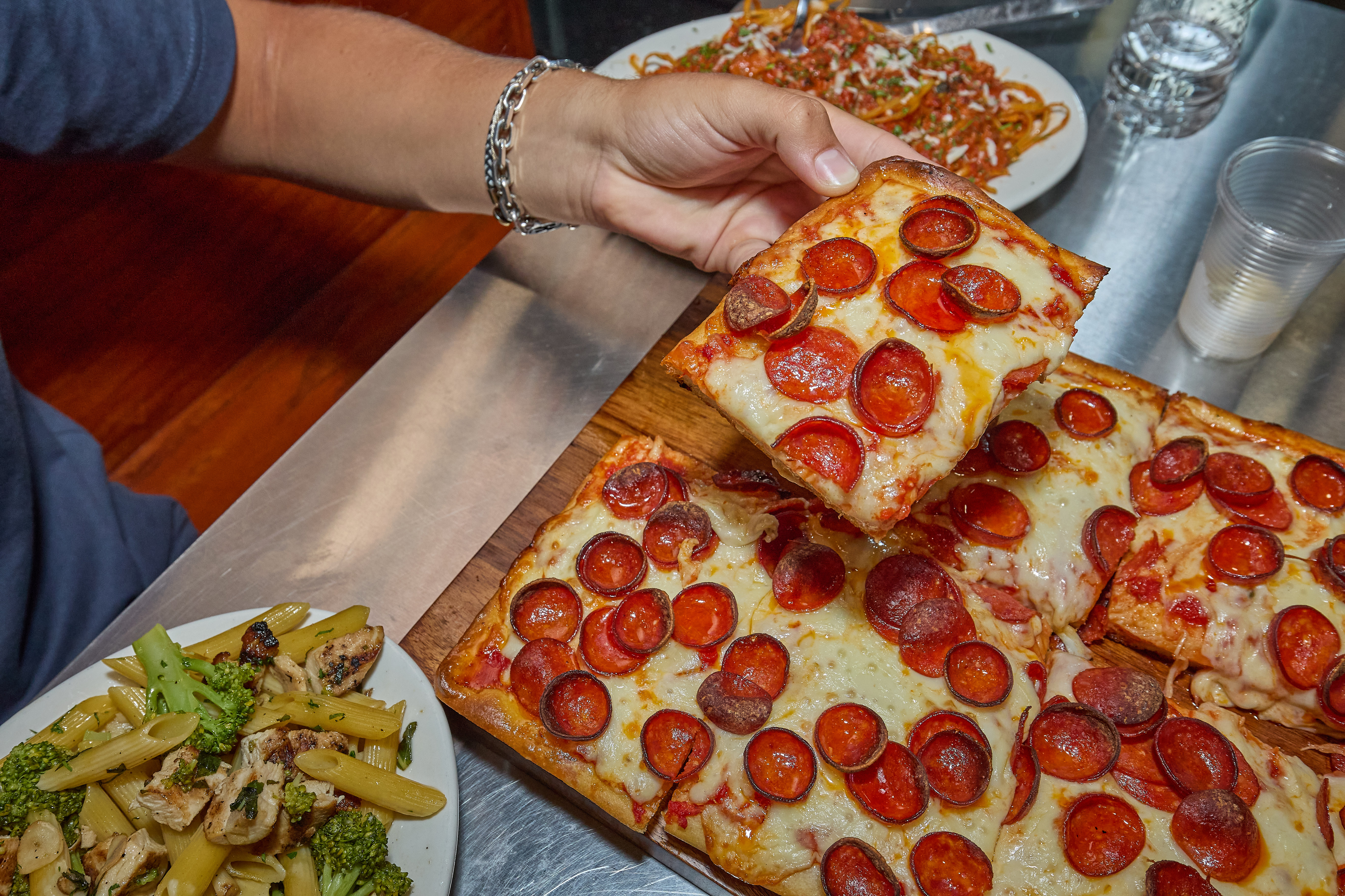 a pepperoni pizza sitting on top of a table