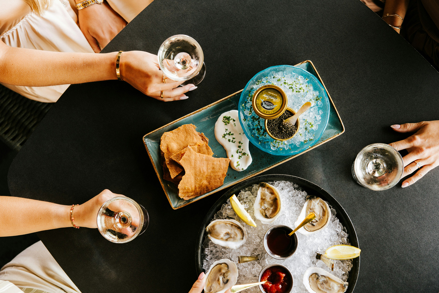 a person sitting at a table with a plate of food