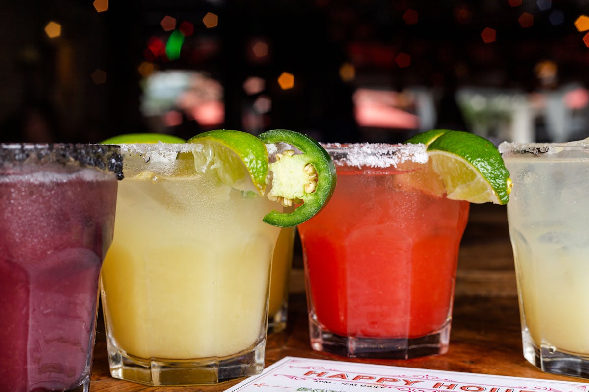 a close up of a glass of beer on a table