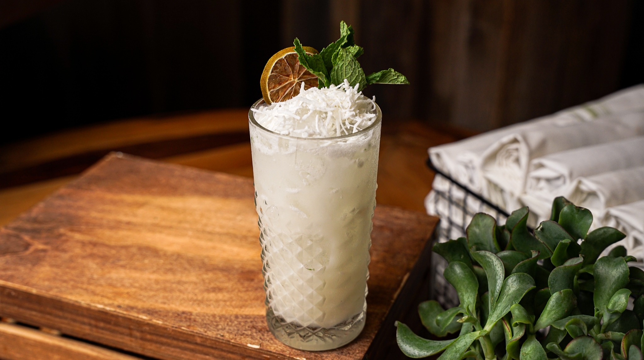 a piece of cake sitting on top of a wooden cutting board