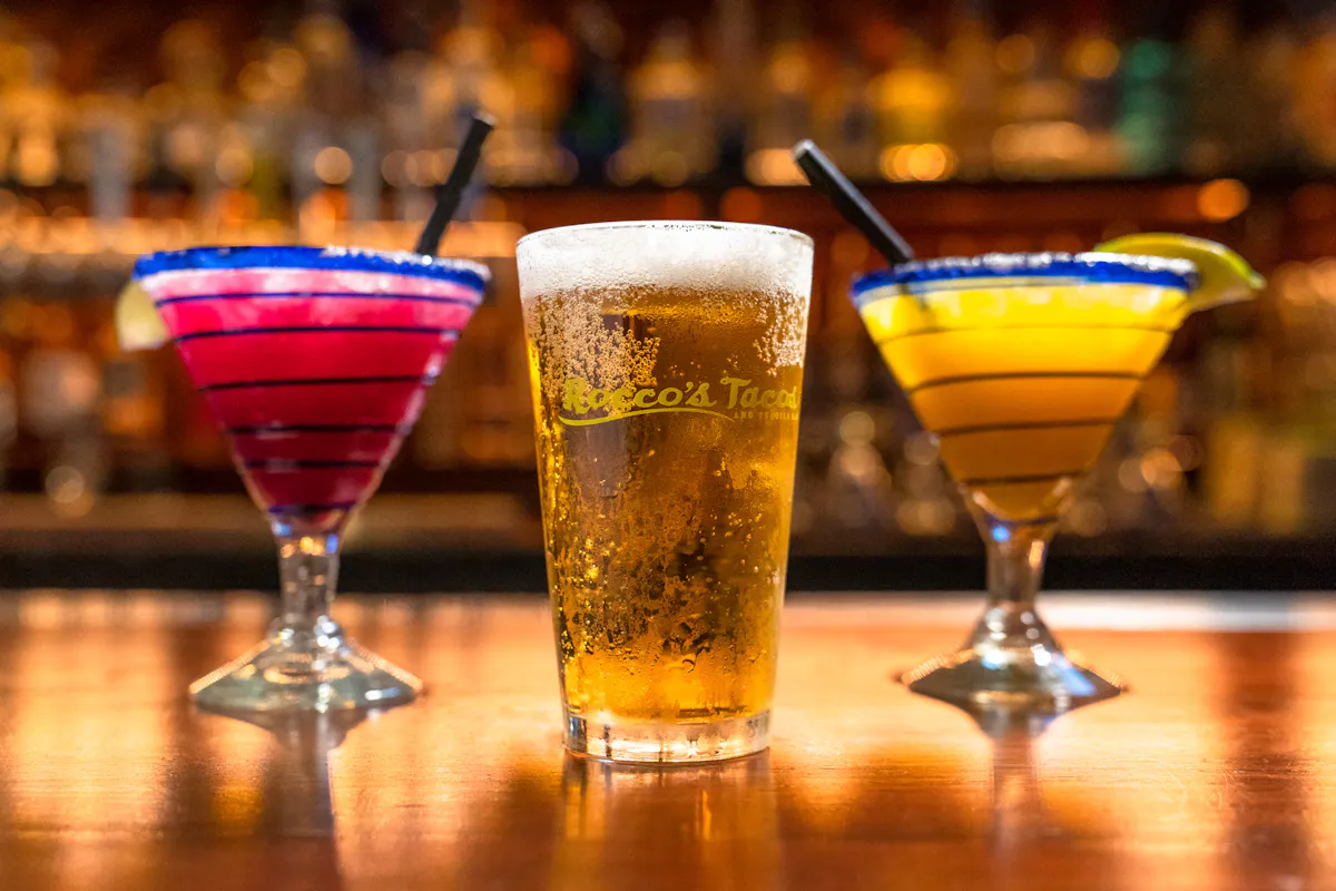 a glass of red wine on a table